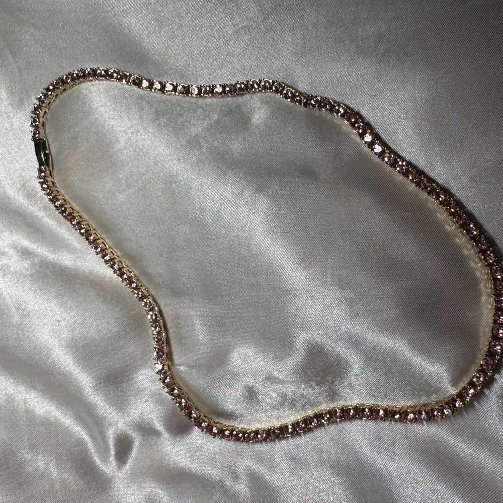 Gold necklace with pink gems